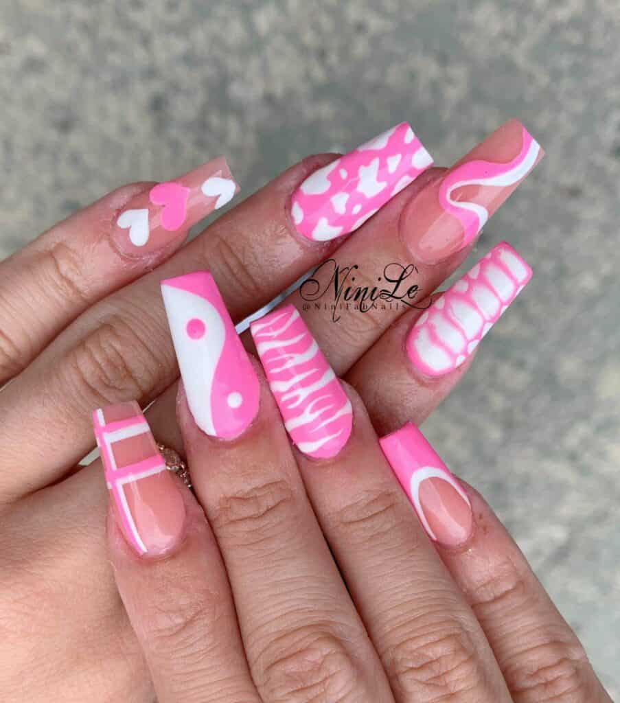 Explore a variety of pink nail designs, from bright and cute styles to festive Christmas nails with intricate patterns and decorations.