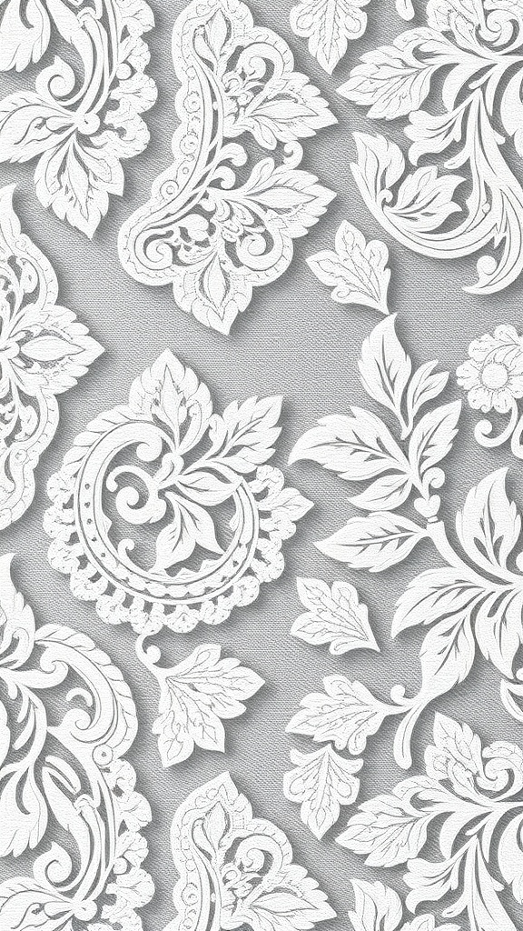 A collection of white lace patterns on a grey background, featuring intricate floral designs.