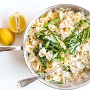 A vibrant array of freshly prepared pasta recipes, including spaghetti, penne, and fusilli, adorned with various sauces, herbs, and garnishes