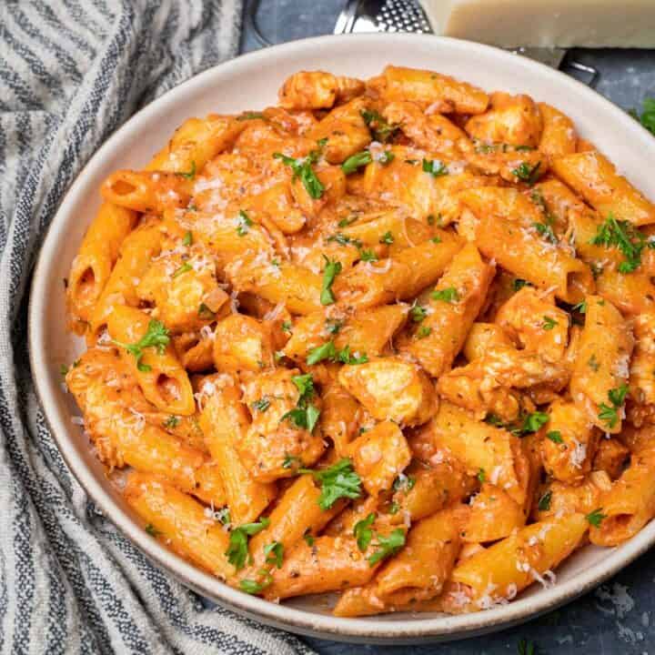 A vibrant array of freshly prepared pasta recipes, including spaghetti, penne, and fusilli, adorned with various sauces, herbs, and garnishes