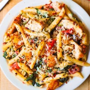 A vibrant array of freshly prepared pasta recipes, including spaghetti, penne, and fusilli, adorned with various sauces, herbs, and garnishes