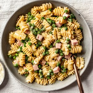 A vibrant array of freshly prepared pasta recipes, including spaghetti, penne, and fusilli, adorned with various sauces, herbs, and garnishes