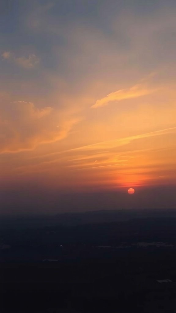 A beautiful sunset with soft hues of orange and pink in the sky.