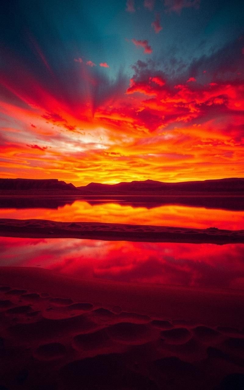 Sunset Desert Lake with Fiery Sky Reflections