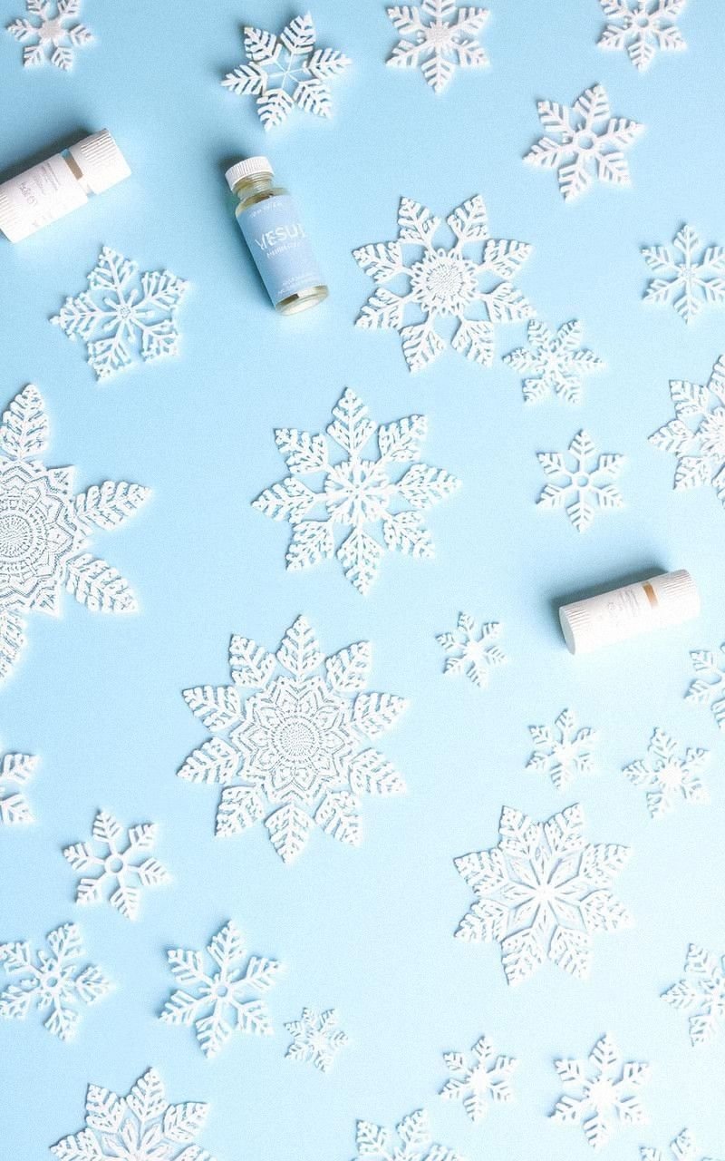 Elegant Snowflake Patterns on Soft Blue Background