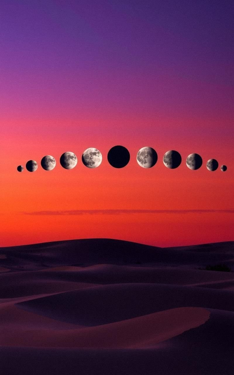 Moon Phases Over Desert Dunes at Twilight