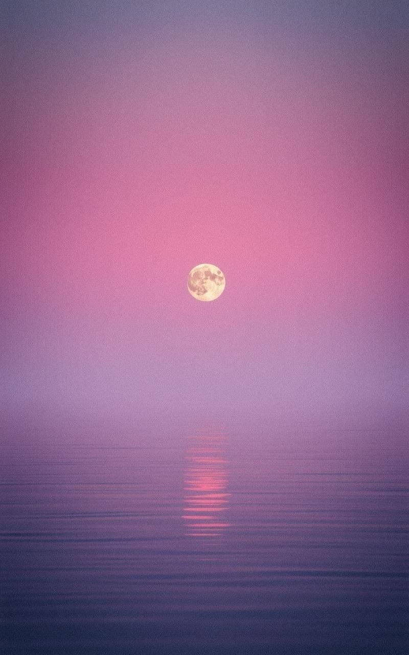 Soft Pink Moon Over Calm Reflective Water