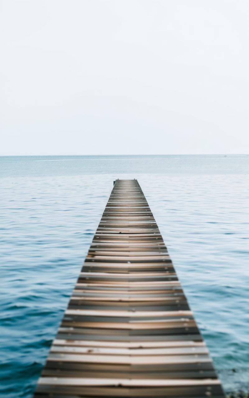 Lonely Wooden Pier Stretching Into Calm Sea