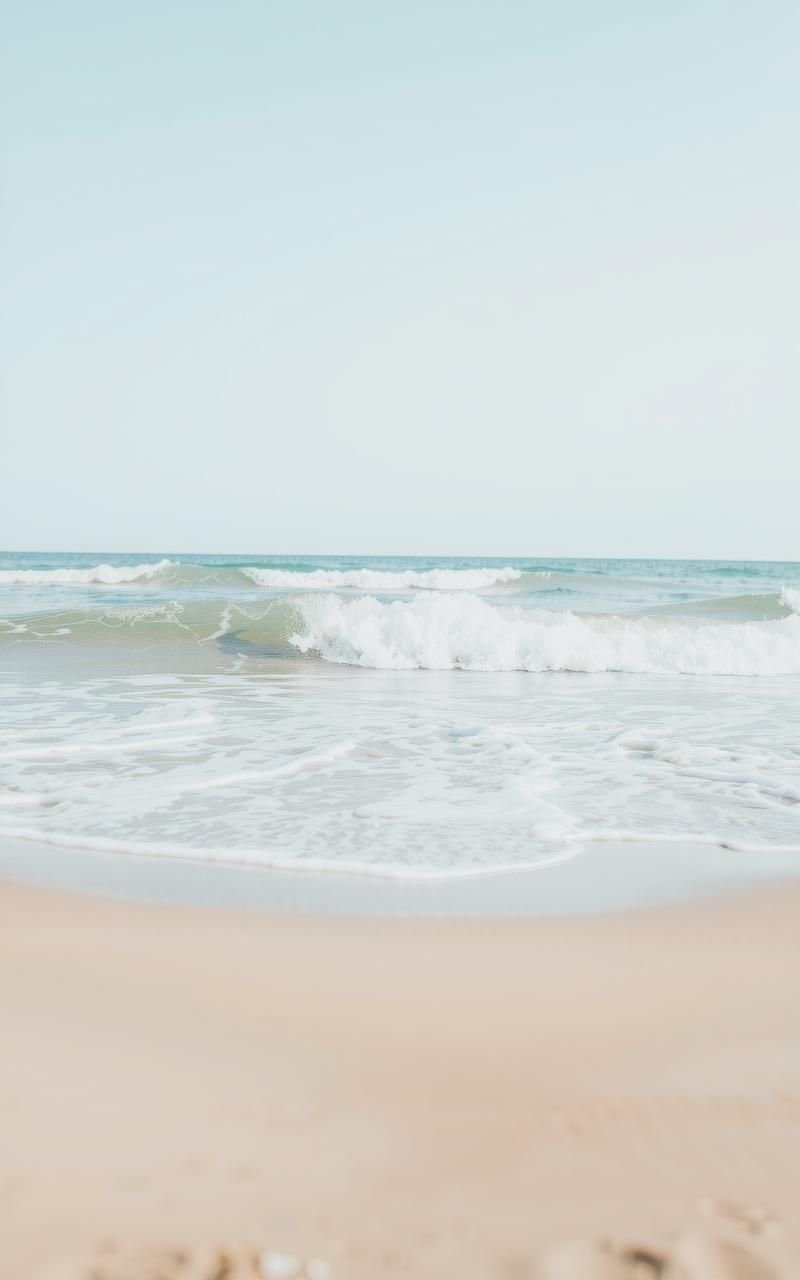 Soft Waves Washing Over Wide Sandy Beach