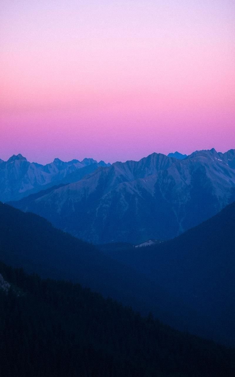 Twilight Casting Purple Hues Over Mountains