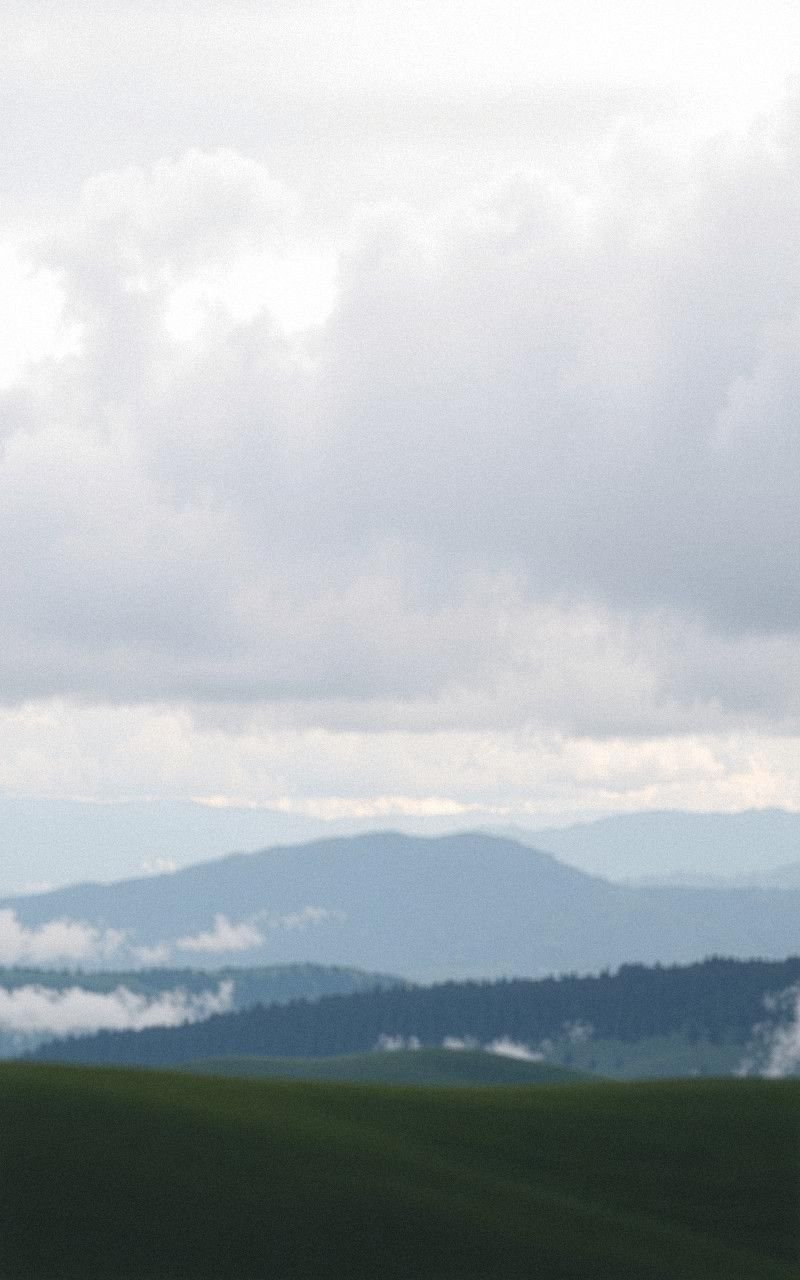 Cloudy Sky Over Gentle Rolling Plains