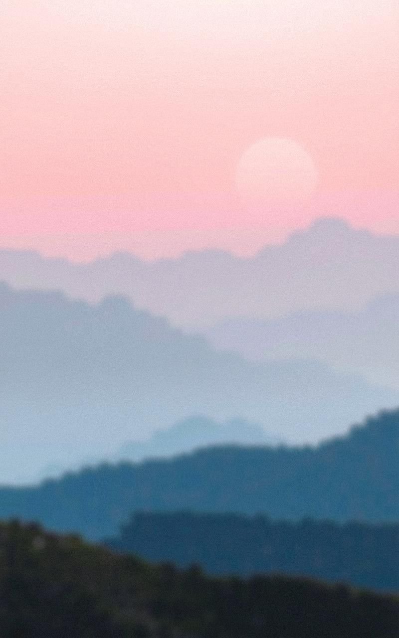 Distant Mountains With Soft Pink Horizon