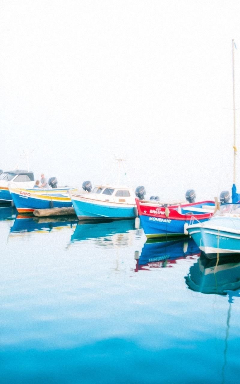 Quiet Harbor With Soft Blue Boats