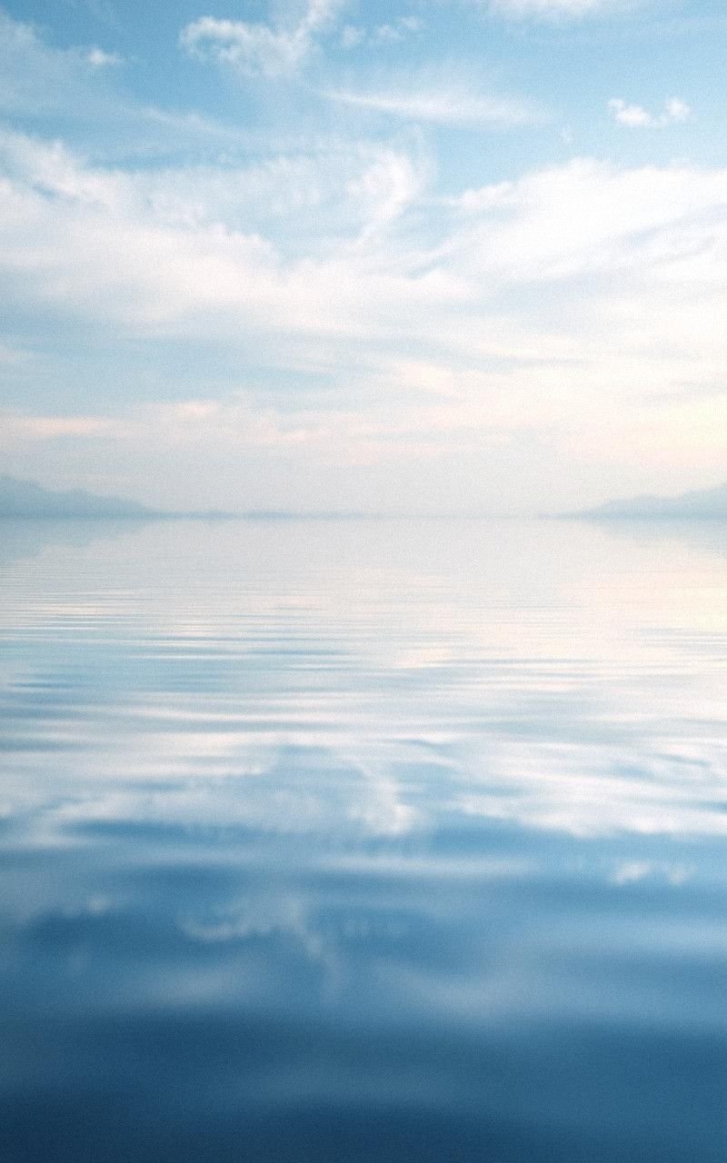 Serene Lake Reflecting Soft Skies