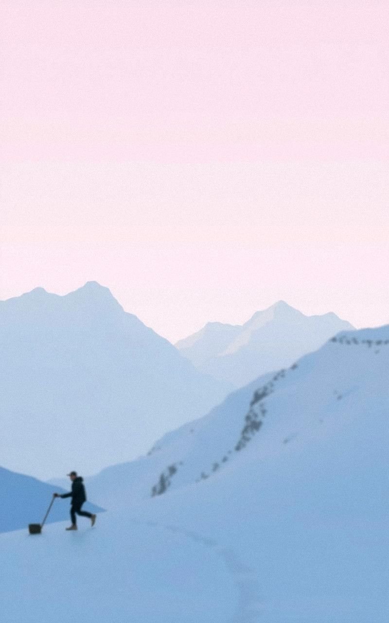 Snowy Mountains Under Pale Lavender Skies