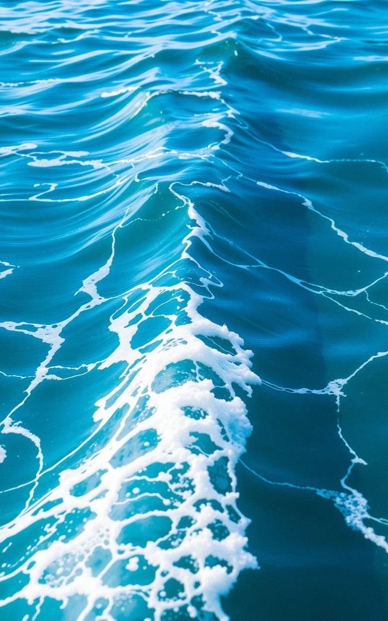 Crystal Clear Blue Waves with Foamy Crests