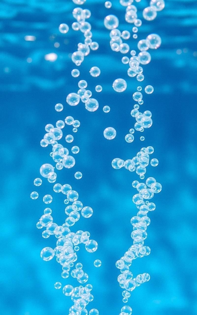 Whimsical Underwater Bubble Trail Rising Upward