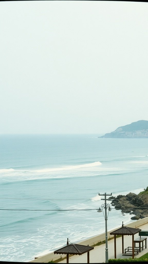 A serene seaside view with gentle waves and a distant coastline.