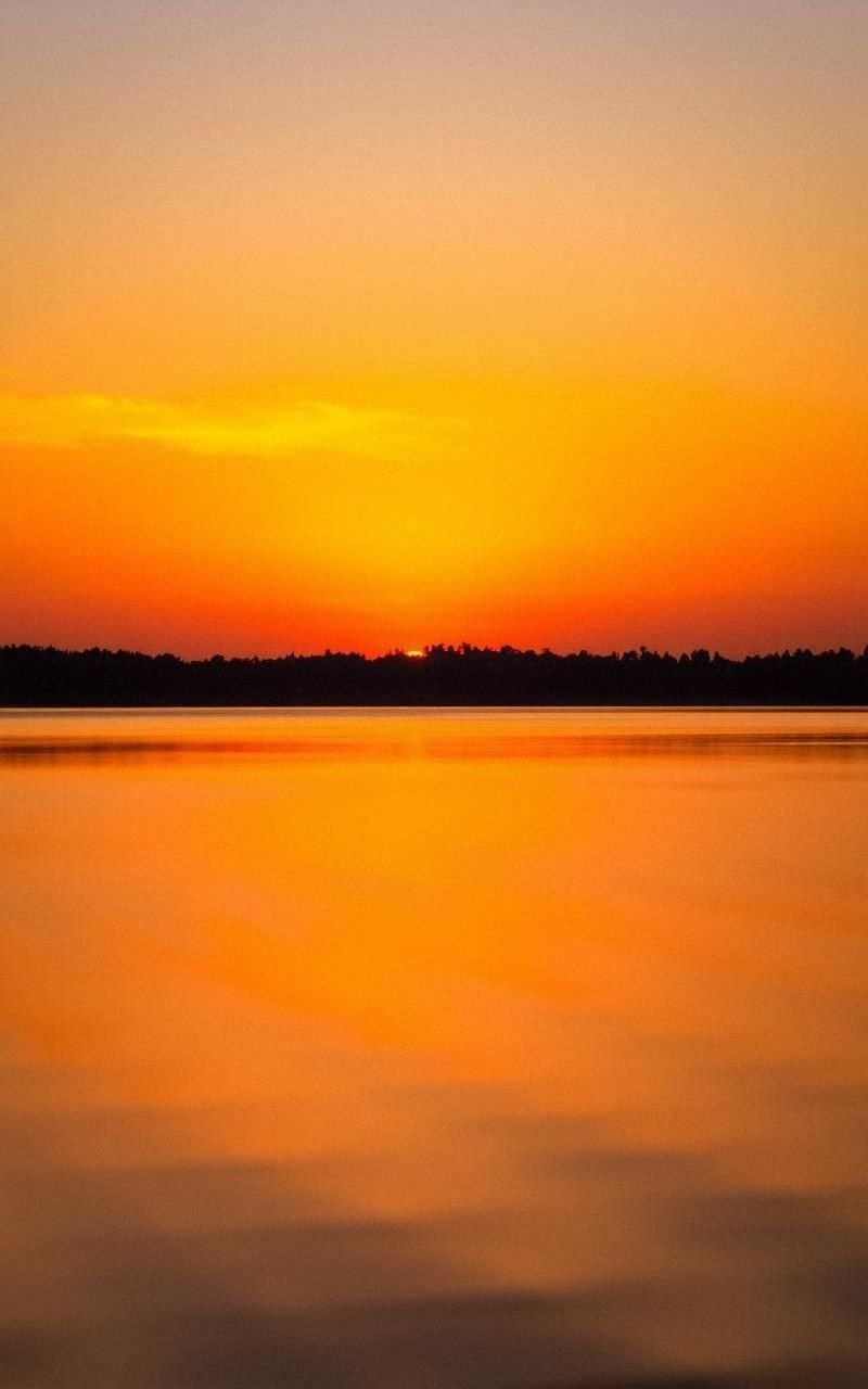 Golden Sunset Over Calm Lake Reflection