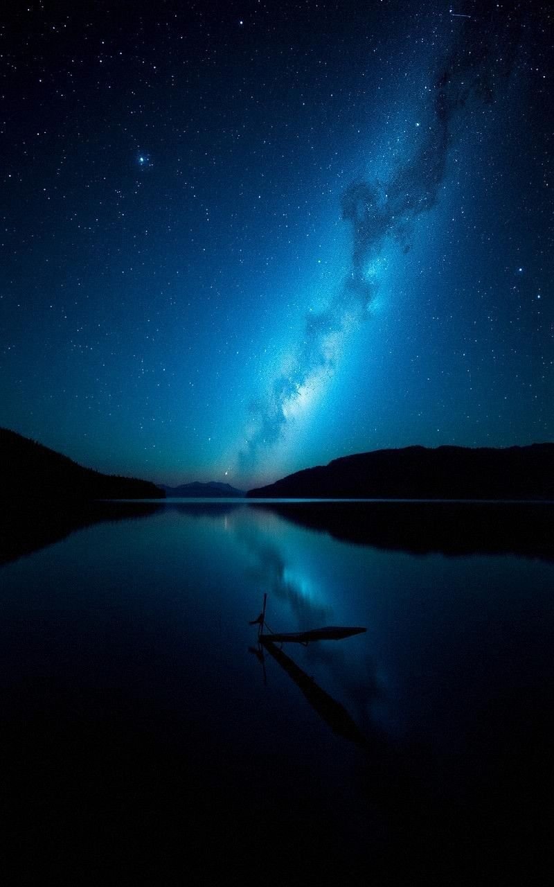 Nighttime Lake with Starry Sky Reflection