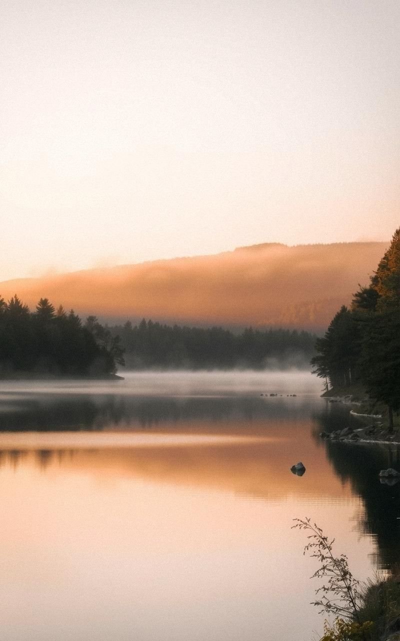 Sunrise Over Quiet Lake with Misty Reflection