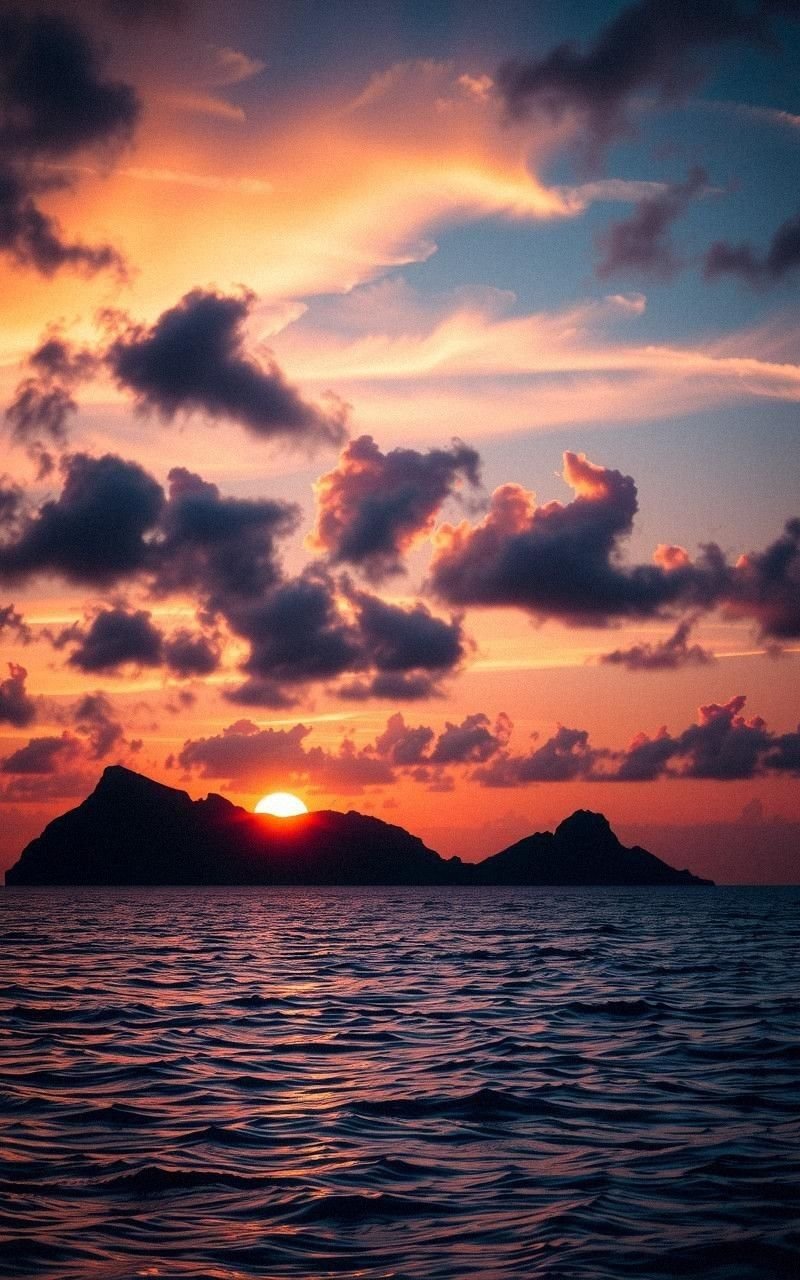 Sunset Over Tropical Islands With Sparkling Waters